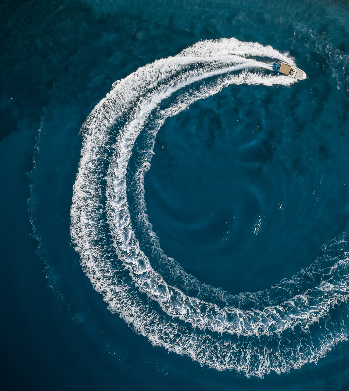 Speedboat Creating C shaped Water Trail