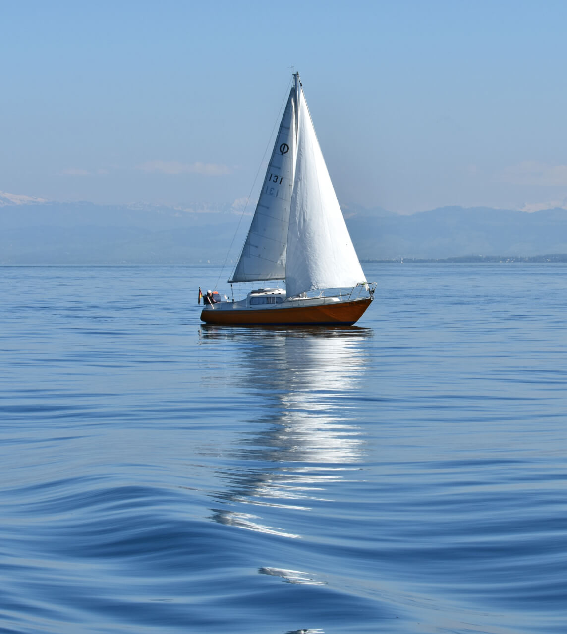 Sailing Boat with Mountains in Background